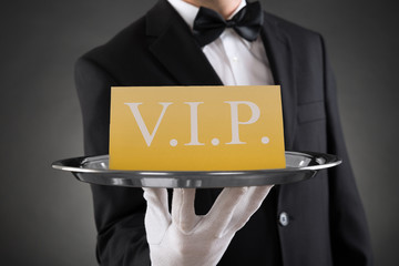 Waiter Showing Vip Text On Banner