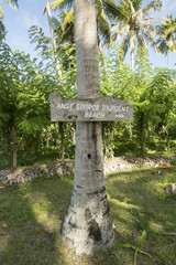 Wood sign.Trail to the tropical beach Source D'Argent at island La Digue, Seychelles. It is one of the best tropical beaches in the world, with big boulders granite rocks and turquoise water. 