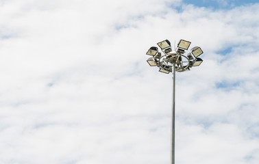 spotlight tower on white cloud sky