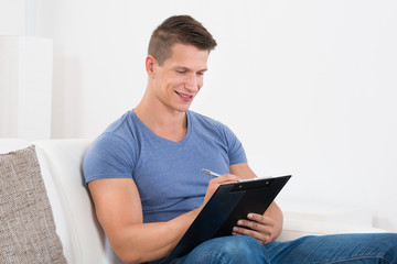 Happy Man With Clipboard