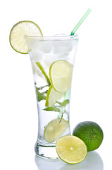 Mojito cocktail with lime on wooden table