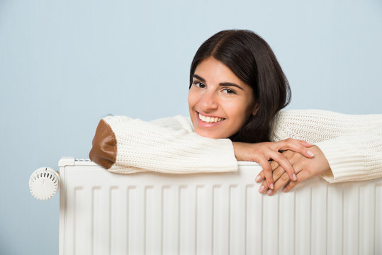 Woman Leaning On Radiator