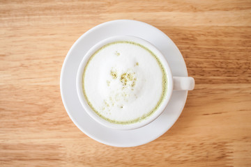 green tea latte on wood table