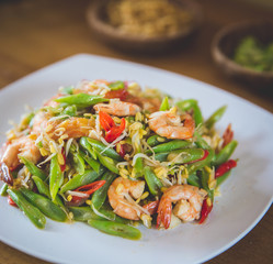 Stir-fry prawn with bean on square white plate
