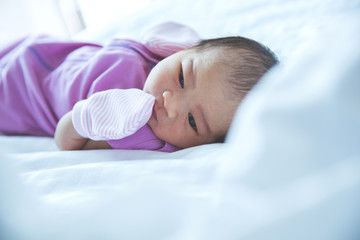 newborn on the bed