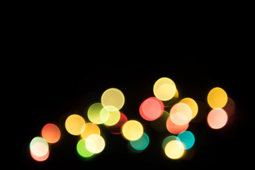 Multicolored defocused bokeh lights background.