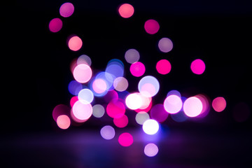 Multicolored defocused bokeh lights background.