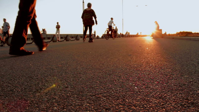 Promenade in big city at sunset