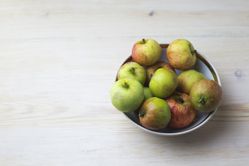 Apples in ceramic colander