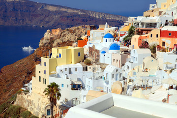 Beautiful view with colorful houses in  village of Oia, Santorin