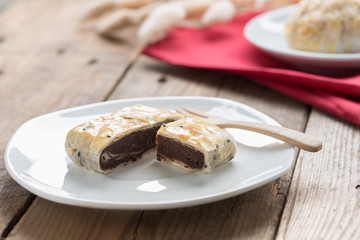 Chinese pastry, pie red bean with black sesame.