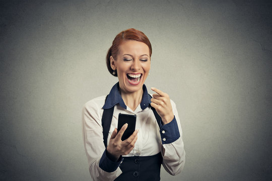 Portrait laughing woman with smart phone