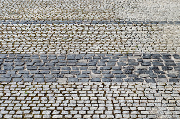 Old road paved with granite stones