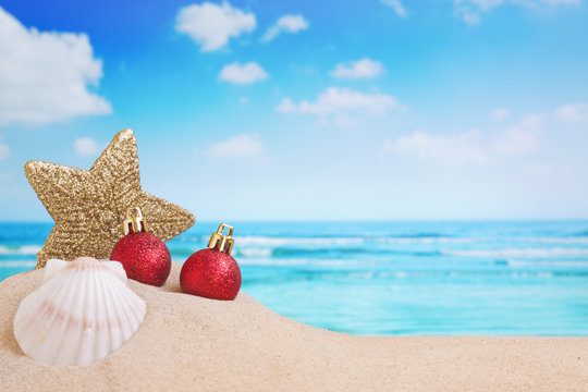 Christmas decorations on the beach, ocean in the back