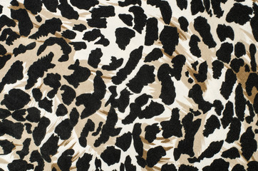 Brown and black leopard fur pattern. Spotted animal print as background. - 90619601