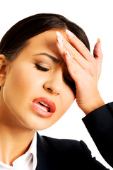 Businesswoman having huge headache