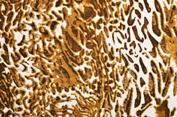 Brown leopard fur pattern. Spotted animal print as background.