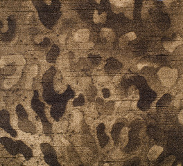 Brown leopard fur pattern. Spotted animal print as background.
