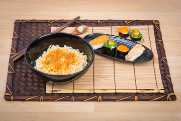 sushi and noodle in black dish