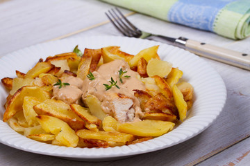 Chicken breasts in mushroom creamy sauce and home fried potatoes
