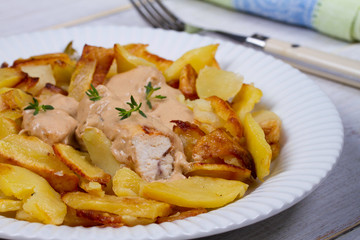 Chicken breasts in mushroom creamy sauce and home fried potatoes