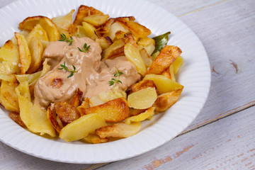 Chicken breasts in mushroom creamy sauce and home fried potatoes