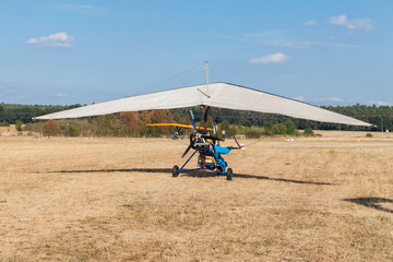 The motorized hang glider on the airfield