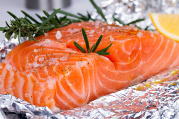 Fresh salmon ready for cooking on the foil paper