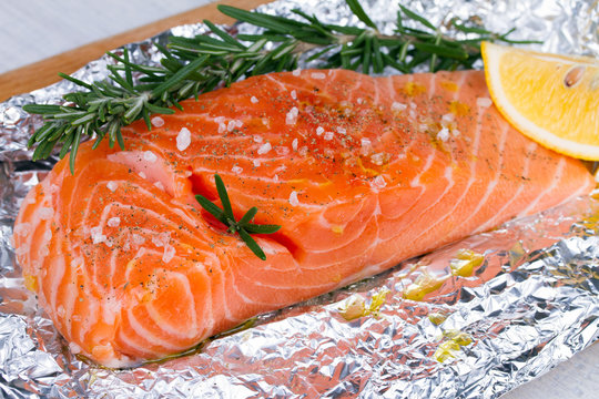 Fresh salmon ready for cooking on the foil paper