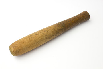 Old wooden pestle isolated on white background