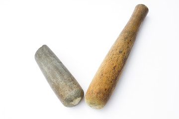 Old wooden pestle and old stone pestle isolated on white background