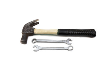 Hammer and wrench on white background