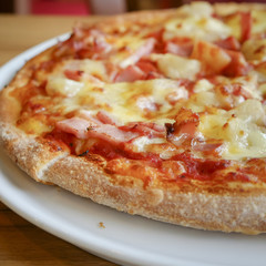 delicious hawaiian rustic style pizza made with fresh pineapples