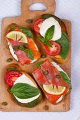 Salmon, Mozzarella, Tomatoes, Lemon, Capers and Pesto Sauce Bruschetta
