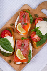 Salmon, Mozzarella, Tomatoes, Lemon, Capers and Pesto Sauce Bruschetta