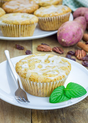 Citrus-glazed sweet potato muffins with pecan nuts and raisins