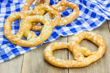 Freshly baked homemade soft pretzels sprinkling with coarse salt