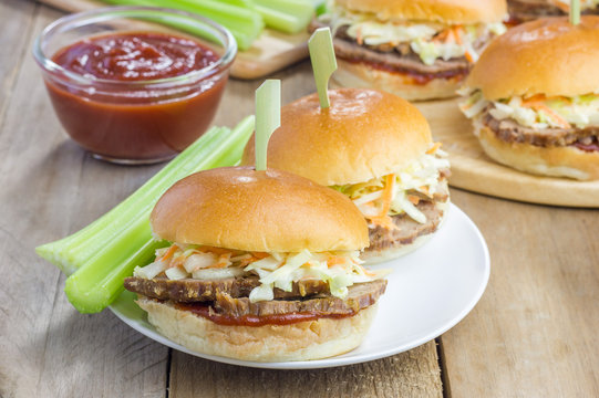 Sliders with beef brisket, barbecue sauce and coleslaw