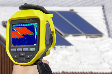 Recording Photovoltaic Solar Panels on the roof House With Thermal Camera 