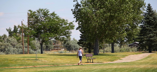 Mature female taking her morning walk outside.