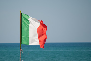 Italian flag over the sea