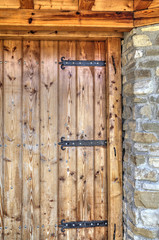 Wooden door with metal ornaments