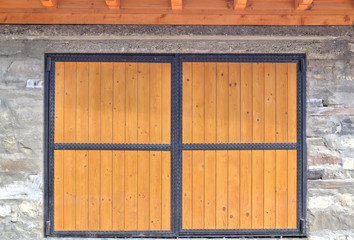 Obraz na płótnie Canvas Wooden door with metal ornaments