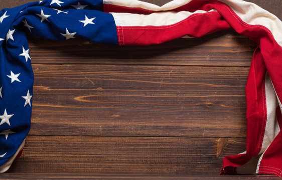 Old American Flag on wooden plank background