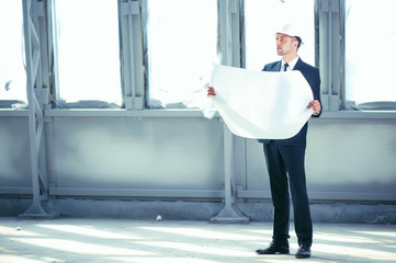 Handsome young engineer is thinking about new project