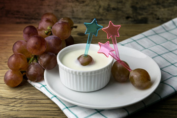 grape yoghurt on the wooden table