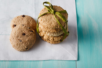 Oat cookies on wood table and cloth