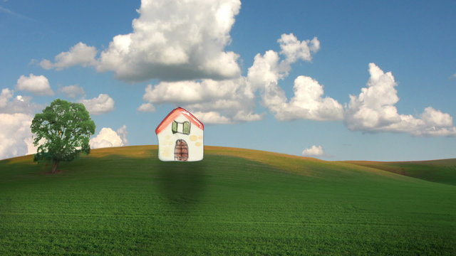 A animated and composed clip representing home building in nice places: a gentle woman hand place a nice little house on a sweet hill.
