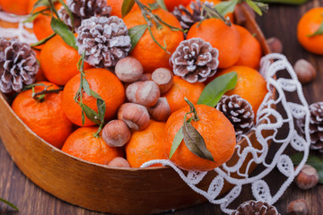 Fototapeta na wymiar Mandarins as a gift.A traditional Christmas decoration. New year holiday