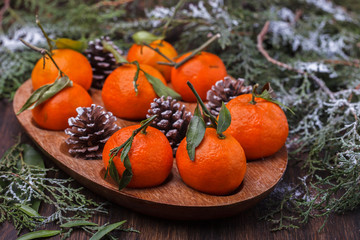 Fototapeta na wymiar Mandarins as a gift.A traditional Christmas decoration. New year holiday